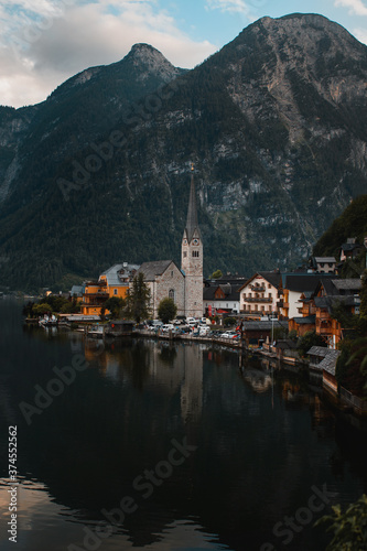 Panorama view of the cute old town located at the Hallstätter Lake on a moody dark rainy day with clouds in the mountains. Hallstatt, Austrian Alps, Salzkammergut in Austria, Europe © Ricardo