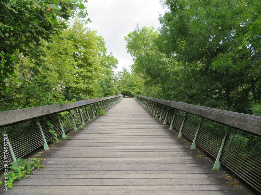 beautiful wooden walkway across a river coming from a very safe bridge beautiful wooden walkway across a river coming from a very safe bridge