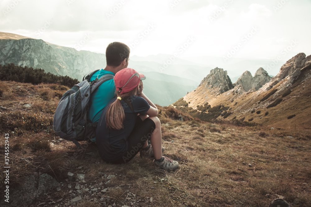 father and son travel hiking in mountains, family tourism, Tatra Mountains national park in Zakopane, Poland - obrazy, fototapety, plakaty 