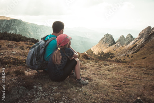 father and son travel hiking in mountains, family tourism, Tatra Mountains national park in Zakopane, Poland