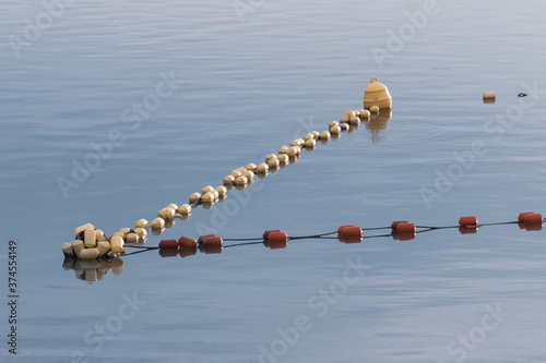water buoys defining the swimming area. Protection water buoys on lake.
