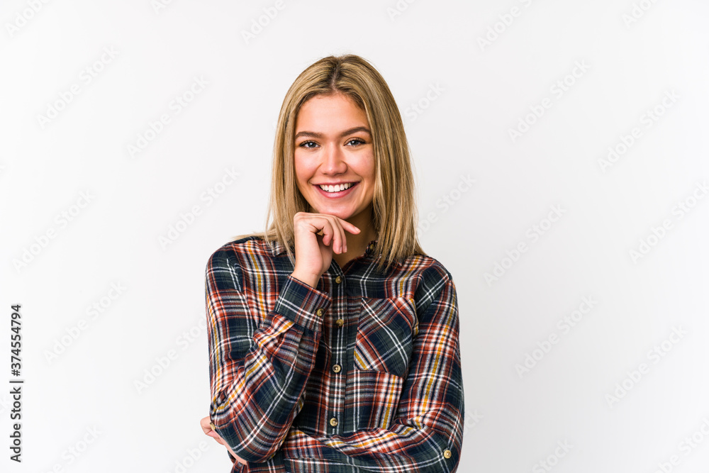 Young blonde caucasian woman isolated smiling happy and confident, touching chin with hand. Young blonde caucasian woman isolated smiling happy and confident, touching chin with hand.