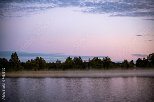 vintage churches on the island at sunrise on the background of the lake