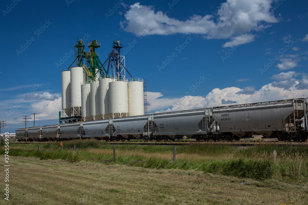 Grain bins in Grande Prairie with freight train in front Grain bins in Grande Prairie with freight train in front