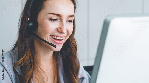 Business people wearing headset working in office to support remote customer or colleague. Call center, telemarketing, customer support agent provide service on telephone video conference call.