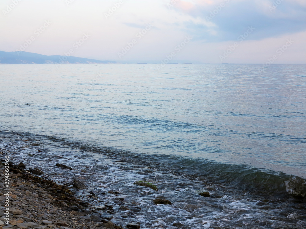 Obraz premium In fog disappears fantastic beautiful sea landscape with view of horizon of silhouette of urban buildings and high-rise buildings off coast of Novorossiysk, Russia. Minimalism. Image shows good grain 