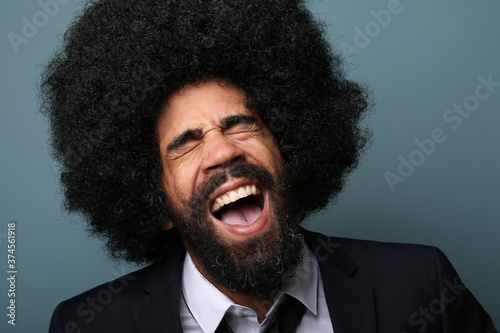 Beautiful afro man in front of a colored background