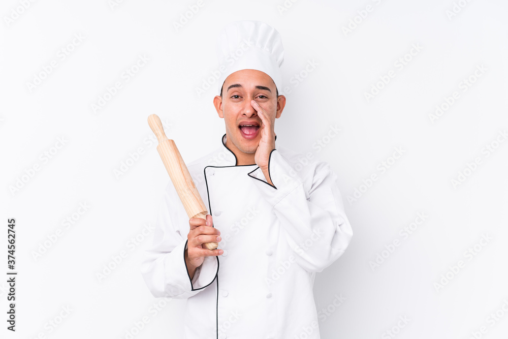 Young latin chef man isolated shouting excited to front. Young latin chef man isolated shouting excited to front.