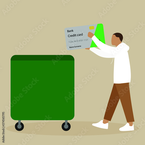 A man throws a credit card into the trash can