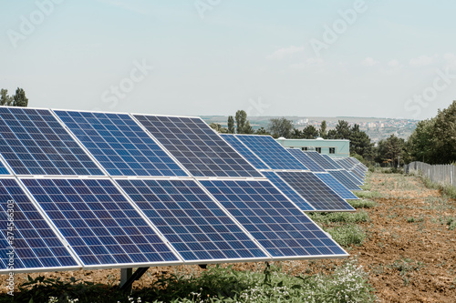 Photovoltaic power plant. Solar photovoltaic panels on blue sky background