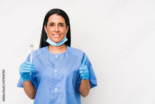 Dentist woman isolated on white background smiling and raising thumb up