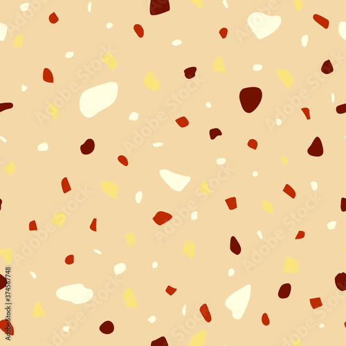 Seamless pattern in beige colors. Nut crumb, mosaic and terrazzo texture. Can be used for decor, textiles, fabrics, packaging, wrapping paper, wallpaper, design, printing.