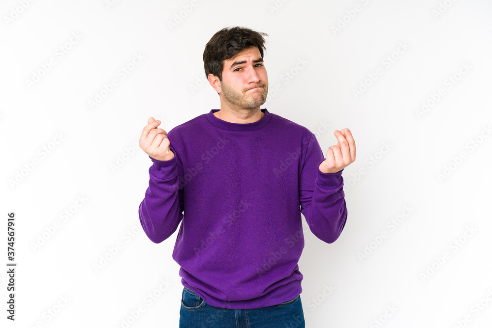 Naklejka premium Young man isolated on white background showing that she has no money.