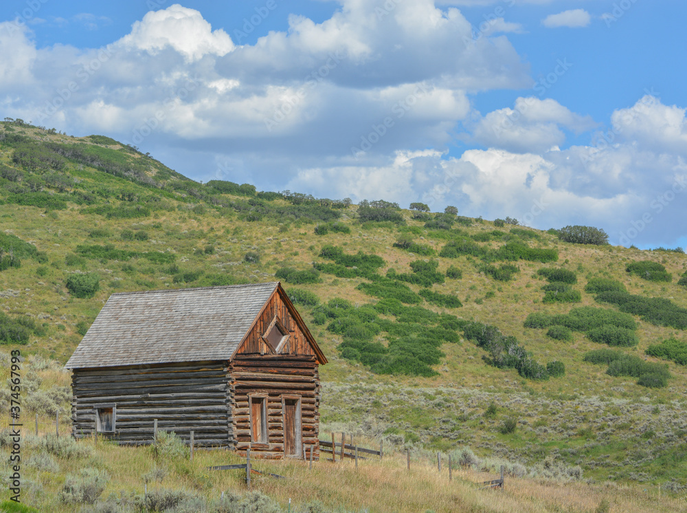 Old log cabin, abandoned in the country hillside of Rocky Mountains in Colorado
