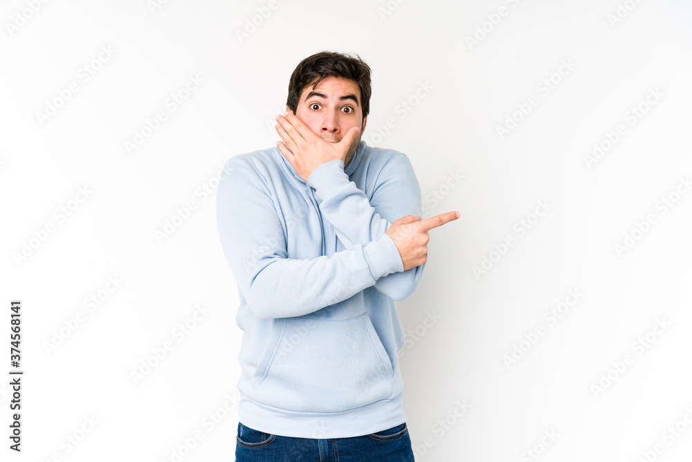 Young man isolated on white background pointing to the side Young man isolated on white background pointing to the side