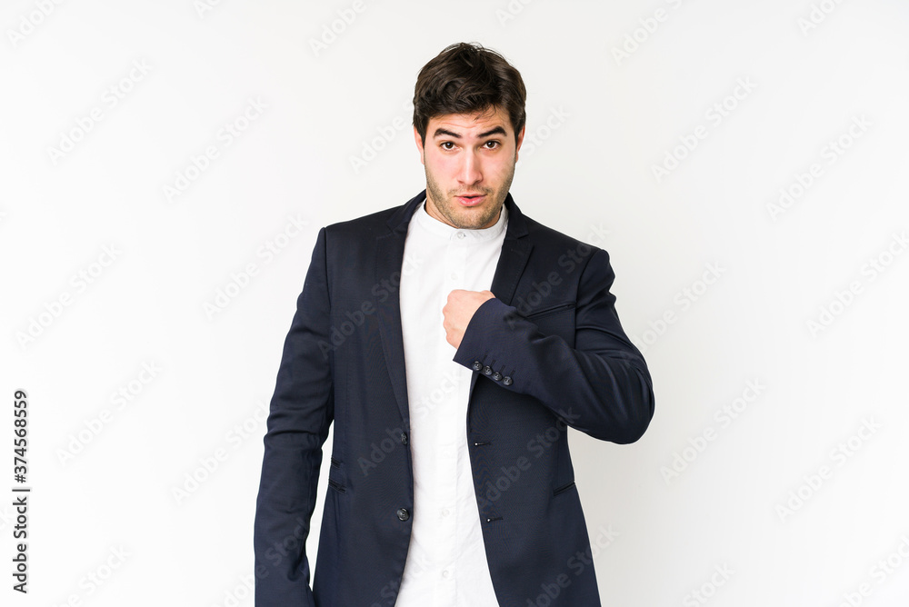 Young business man isolated on white background surprised pointing with finger, smiling broadly. Young business man isolated on white background surprised pointing with finger, smiling broadly.