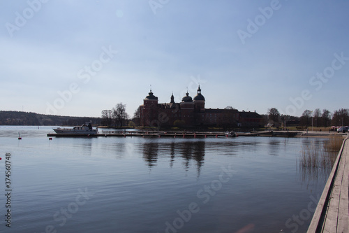 Mariefred pier and Gripsholm Castle in a sunny day, Mariefred, Sweden.