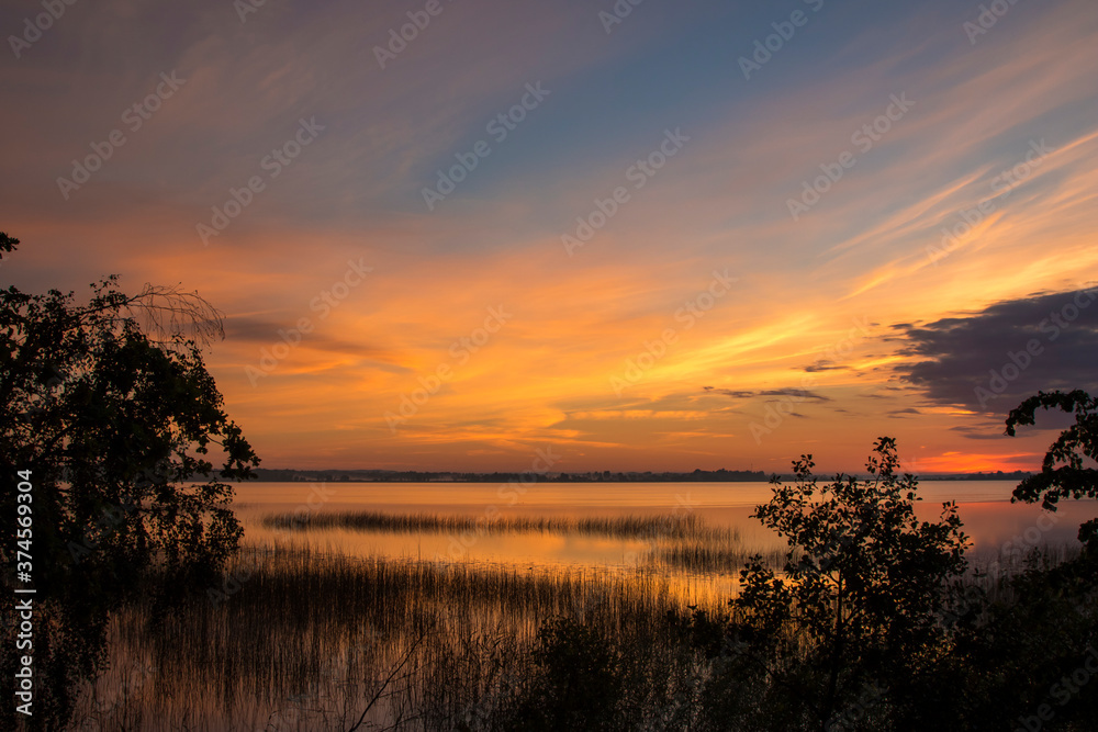 Summer lake at dawn, nature background.