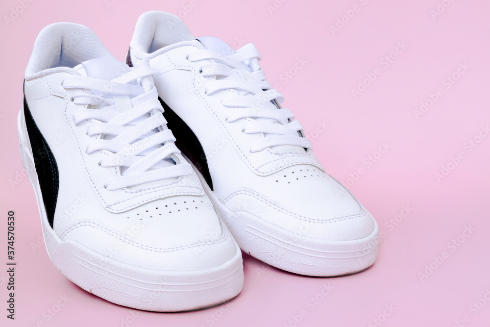Mens sneakers on a pink background. Mens sneakers on a pink background.
