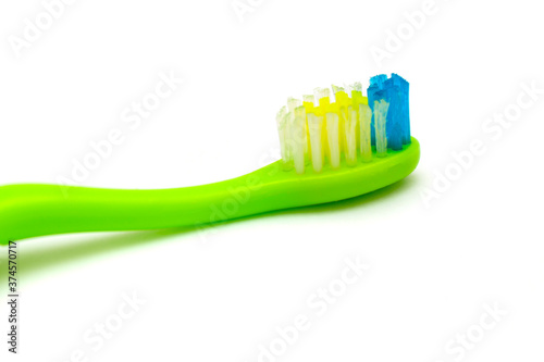 White background on it toothbrushes of different colors are arranged in a chaotic manner oral hygiene isolate  brushing teeth