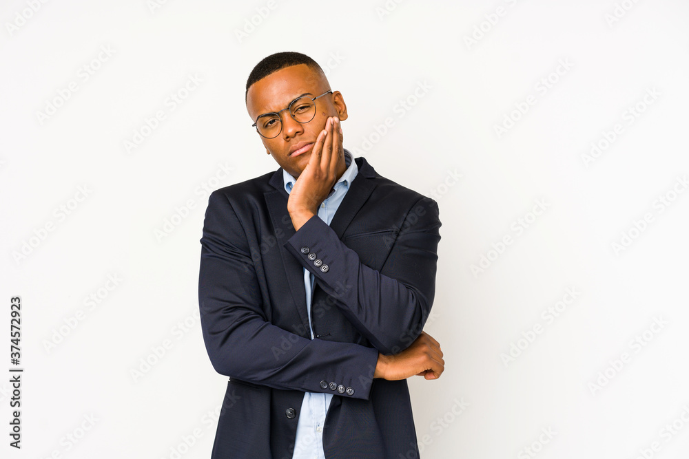 Young business latin man isolated on white background who is bored, fatigued and need a relax day.