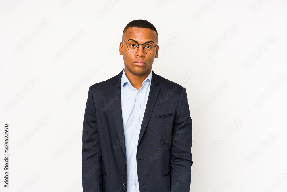 Young business latin man isolated on white background shrugs shoulders and open eyes confused. Young business latin man isolated on white background shrugs shoulders and open eyes confused.
