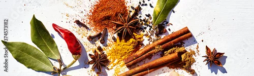 Obraz  z motywem Various types of spices and herbs kitchen on white background with copy space.