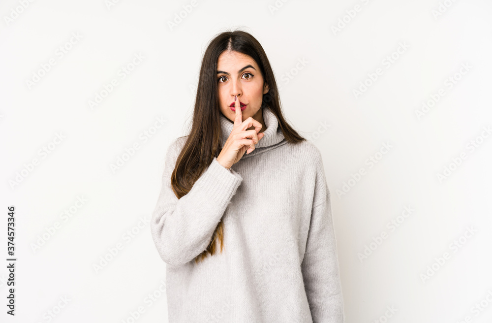 Young caucasian woman isolated on a white background keeping a secret or asking for silence. Young caucasian woman isolated on a white background keeping a secret or asking for silence.