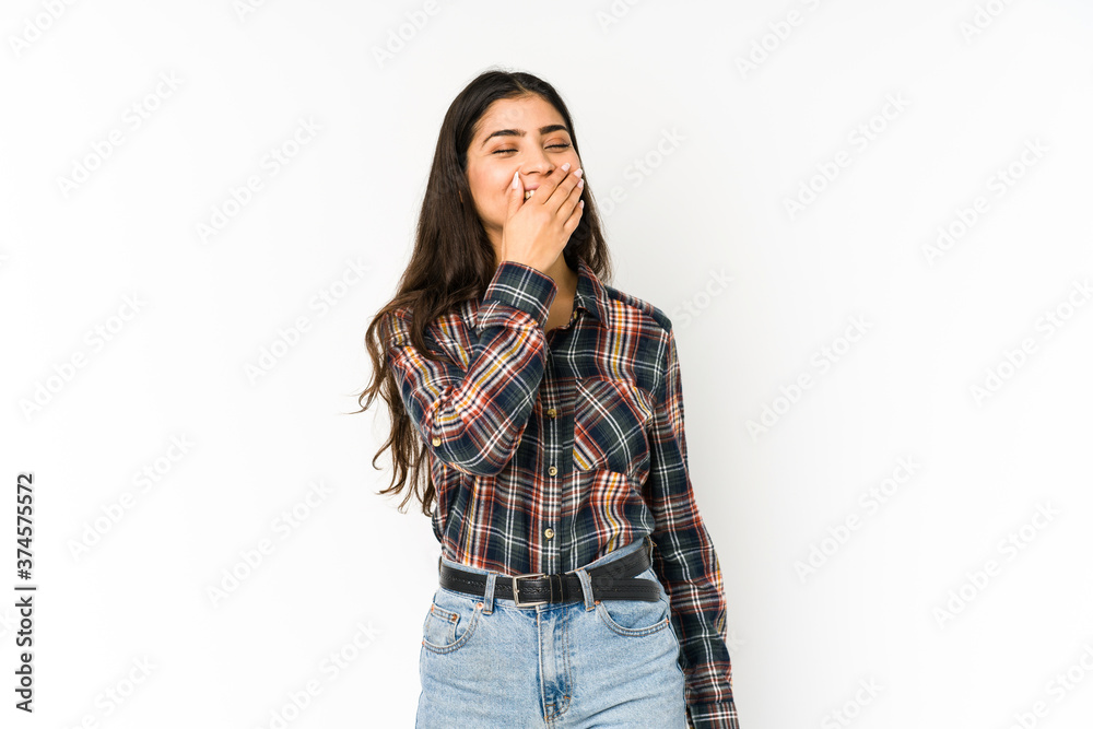 Young indian woman isolated on purple background laughing happy, carefree, natural emotion. Young indian woman isolated on purple background laughing happy, carefree, natural emotion.