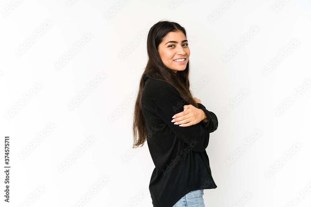 Young indian woman isolated on purple background laughing and having fun. Young indian woman isolated on purple background laughing and having fun.
