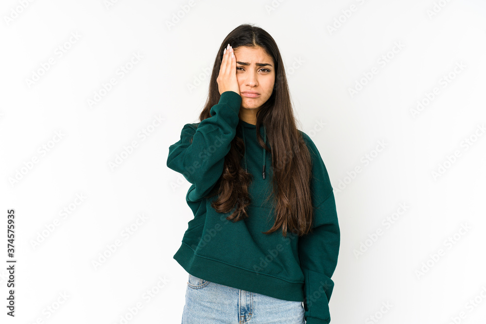 Young indian woman isolated on purple background tired and very sleepy keeping hand on head. Young indian woman isolated on purple background tired and very sleepy keeping hand on head.