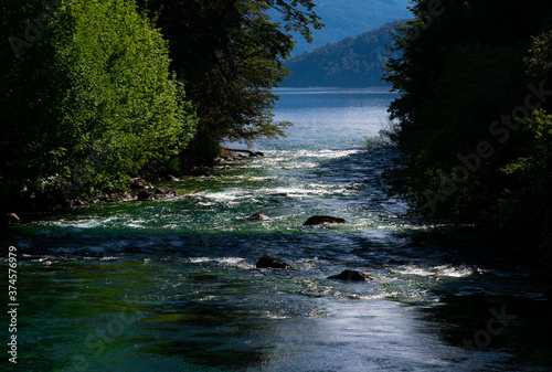 View of Correntoso River (Rio Correntoso), runs from Correntoso Lake to Nahuel Huapi Lake, standing out as one of the shortest rivers in the world. Villa La Angostura, Argentina photo