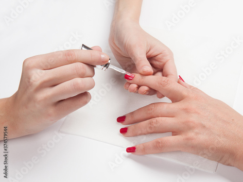 Woman in a nail salon receiving a manicure