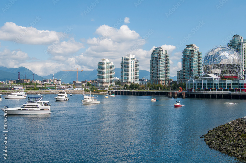 Vancouver, British Columbia /Canada Jul-25-2014 > False Creek surrounded by buildings and boats on a sunny summer morning