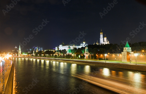 The Moscow Kremlin in evening. Embankment  towers  temples  car traces