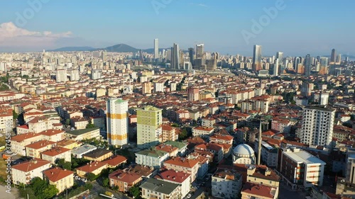 Aerial of over dense residential area with many houses and buildings in Istanbul. Urbanization landscape of housing over Umraniye - Atasehir regions. Flying over, looking down on residential community photo