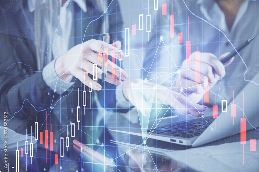 Multi exposure of man and woman working together and financial chart hologram. Business concept. Computer background. Multi exposure of man and woman working together and financial chart hologram. Business concept. Computer background.