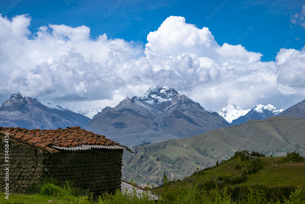 Rustic peruvian house sitting infront of the Andes