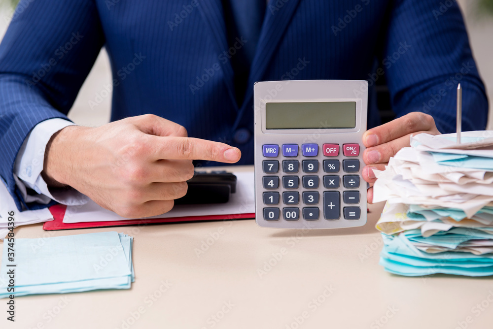 Young male financial manager in the office Young male financial manager in the office
