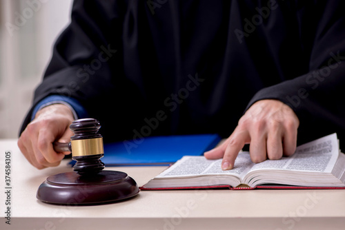 Photography Young male judge working in courthouse