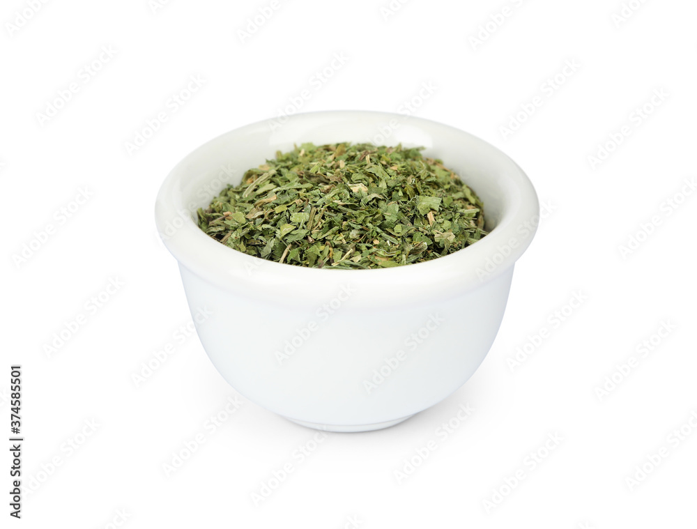 Dry parsley in ceramic bowl on white background Dry parsley in ceramic bowl on white background