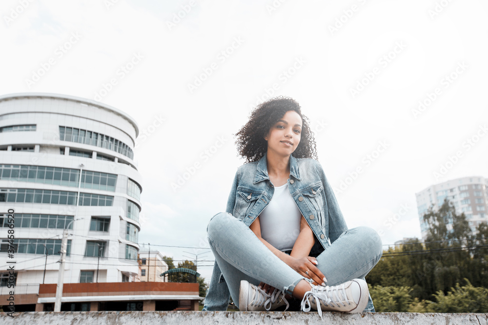Fototapeta premium Black young pretty girl relaxing outdoor