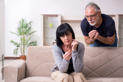 Old couple having argument at home