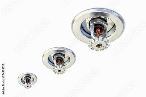 close-up ceiling mounted fire sprinkler in the building concepts of fire alarm prevention and safety system.