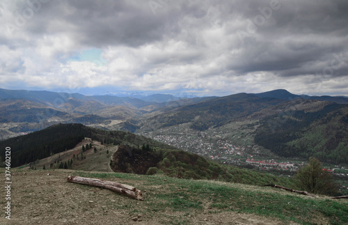 top view of rural town in the mountain valley at cloudy day