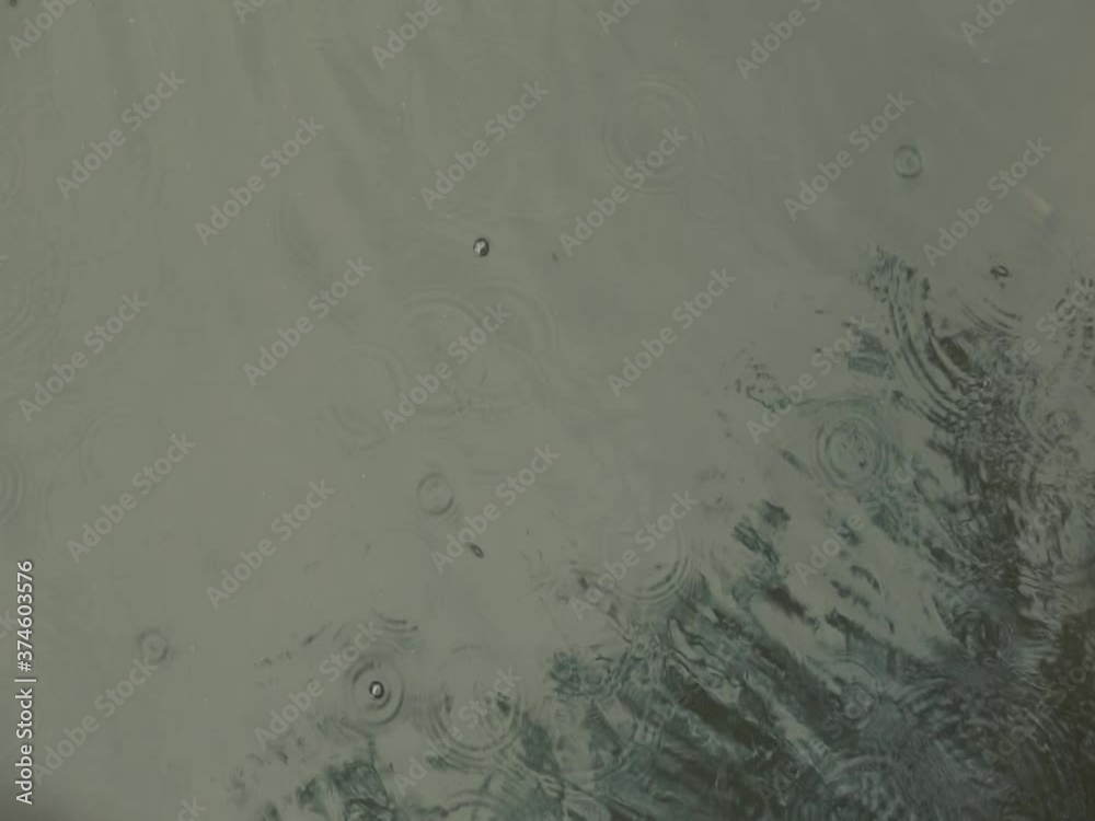 The waves reflect the rain water pouring into the black water. The waves reflect the rain water pouring into the black water.