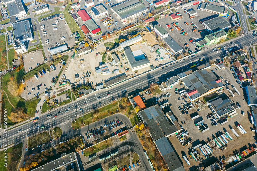urban industrial area with manufacturing buildings, warehouses and logistic center. aerial top view