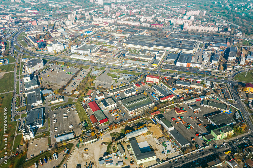 aerial panoramic view of city industrial district with many manufacturing buildings and warehouses