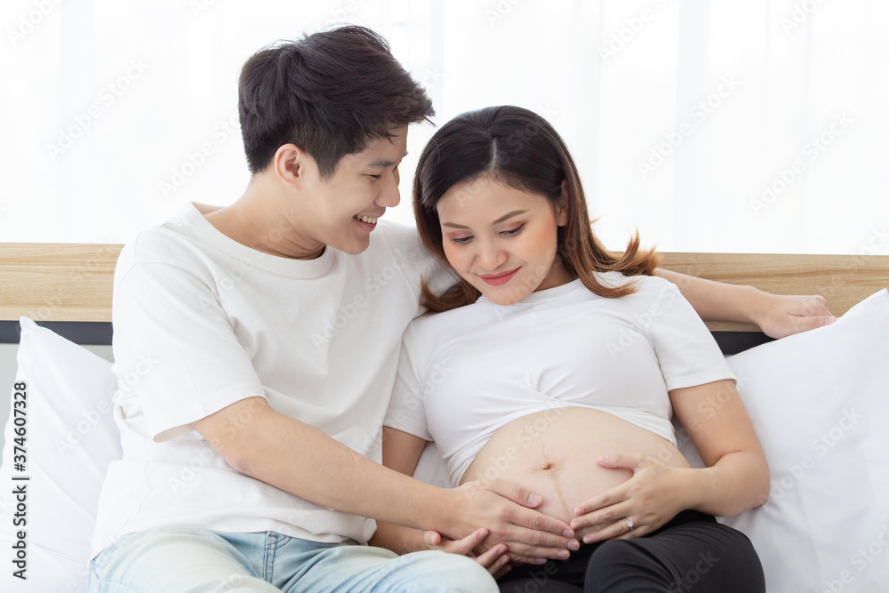 Asian lovely husband and wife portrait, his wife is in pregnancy. Asian lovely husband and wife portrait, his wife is in pregnancy.