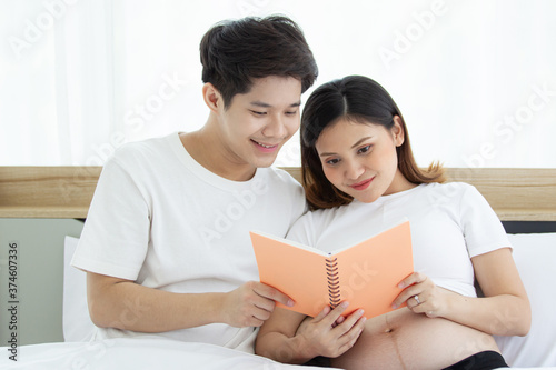 Portrait of lovely husband and wife reading a book together.  © DG PhotoStock